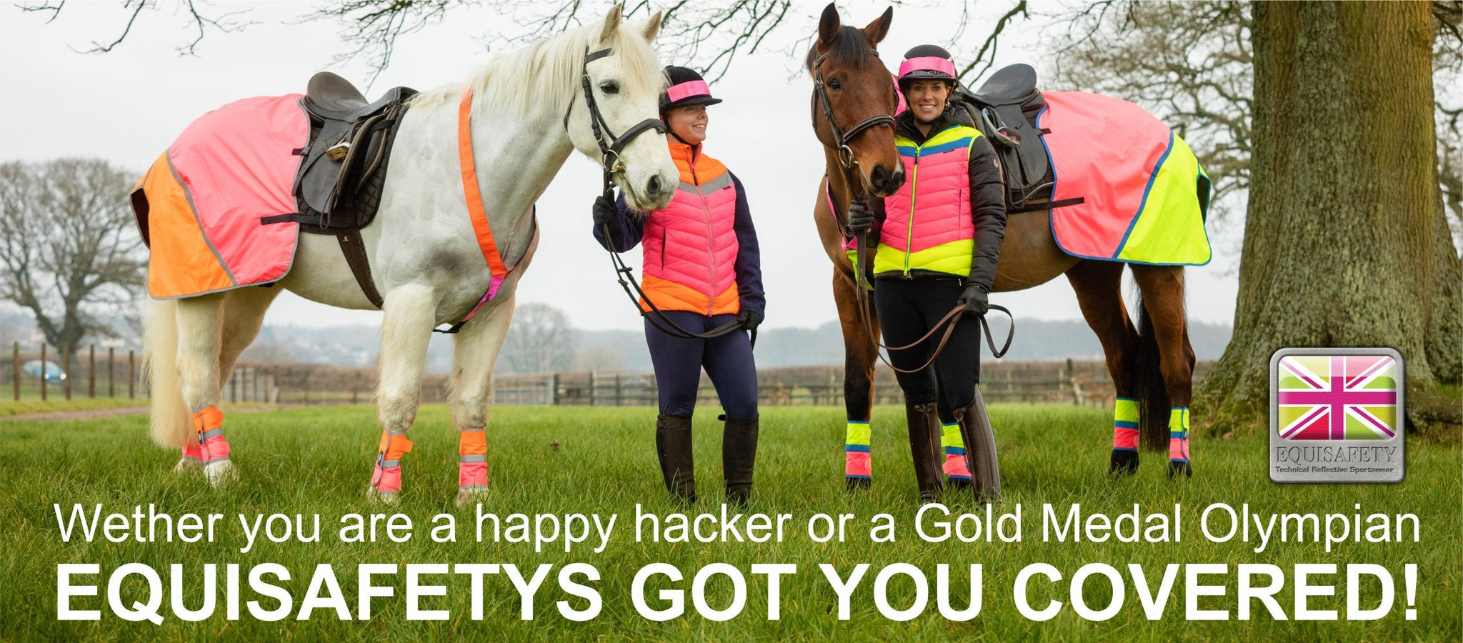 Two horses and riders wearing hi vis in a green field.
