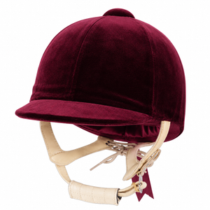 A burgundy velvet equestrian riding helmet with cream-colored leather chin straps and gold-tone metal hardware, shown against a plain white background.
