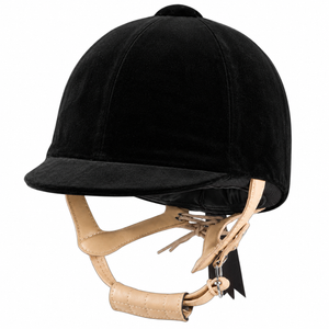 A black equestrian riding helmet made of plush velvet, featuring a matching black visor and tan leather chin strap with silver metal hardware, shown against a plain white background.