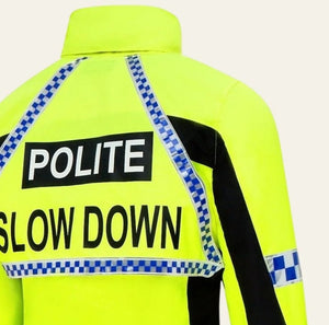 A close-up of the back of a high-visibility neon yellow jacket with blue-and-white checkered reflective strips and large black text reading 'POLITE' and 'SLOW DOWN'.