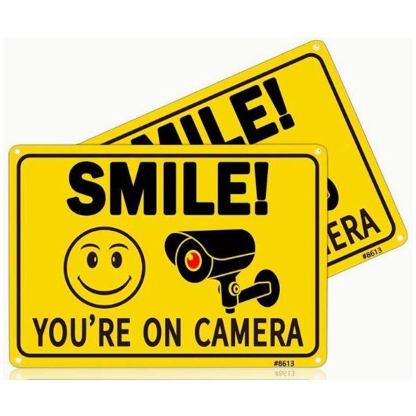 Smile You Are On Camera sign.