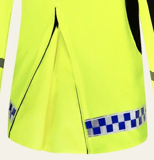 Close-up of a high-visibility neon yellow jacket with a blue and white checkered reflective strip near the hem and black piping details.